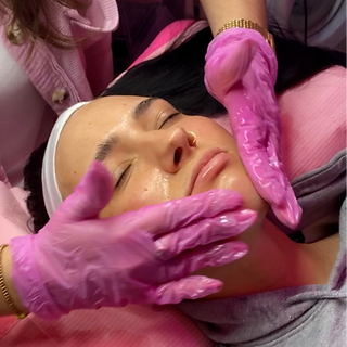 A client is relaxing while getting a facial massage.