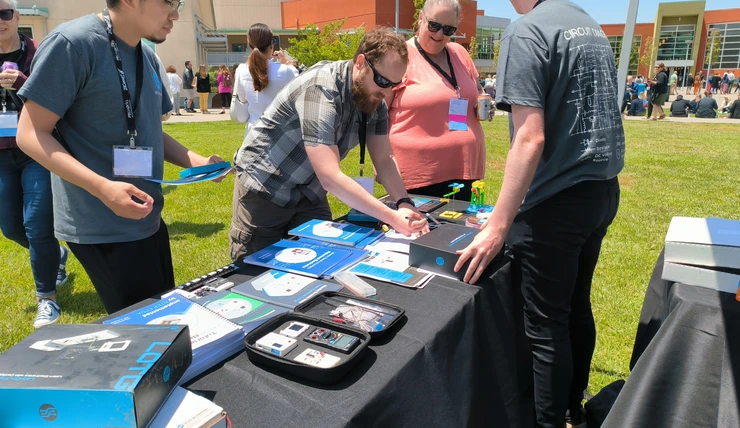 Our team members demonstrating our products to curious attendees.