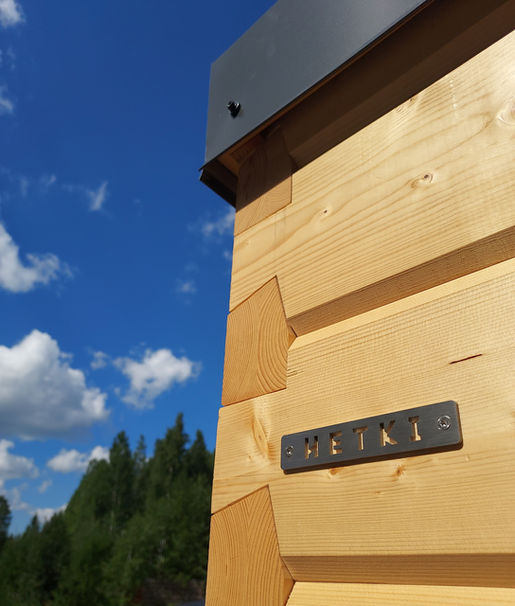 Hetki outdoor Finnish log sauna corner close-up showing traditional dovetail joint craftsmanship made in Finland.