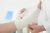 depositphotos_159452016-stock-photo-doctor-applying-bandage-onto-patients.jpg
