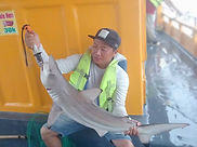 Deep-sea fishing on Phu Quoc capturing a proud moment with the day's catch! A unique and t