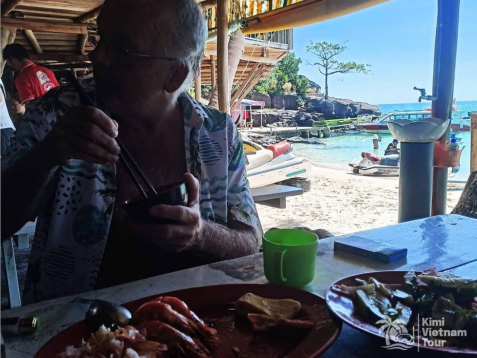 Relaxing lunch on the beach of Mong Tay island after morning snorkeling with Tomas & Van Anh - Kimi Vietnam Tour Phu Quoc