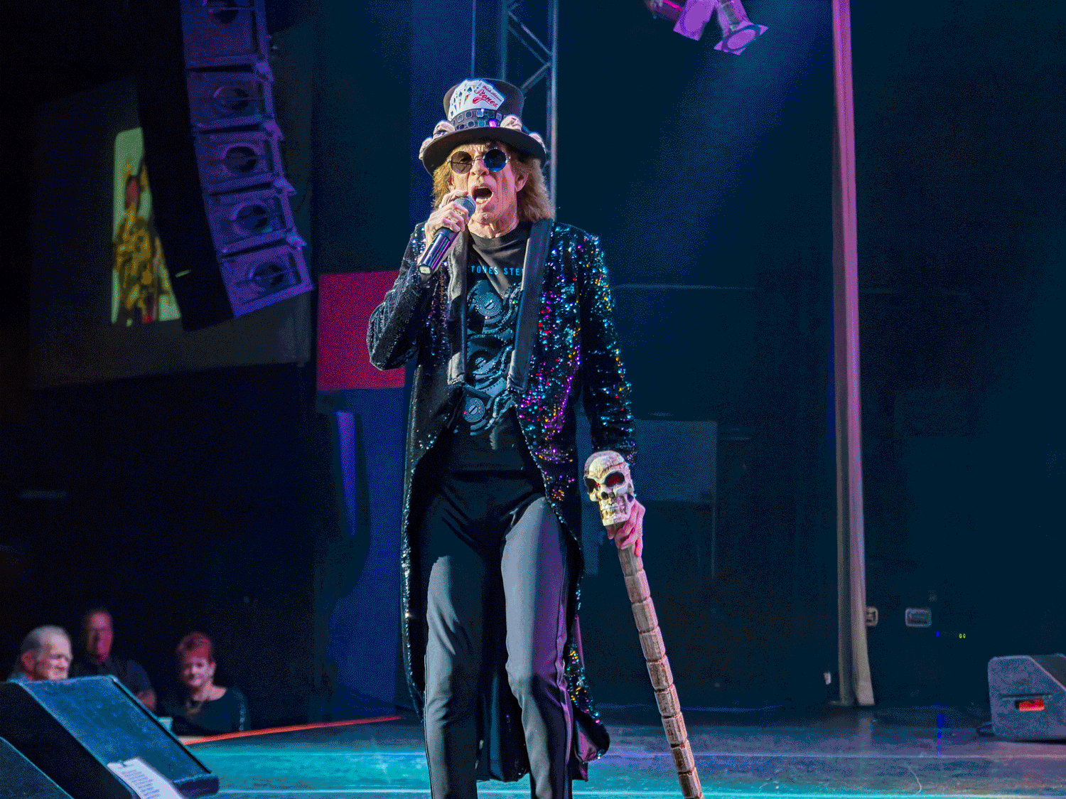 Dancing across the stage in top hat with staff