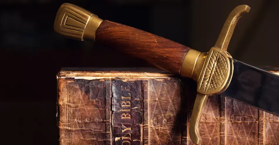 6294-sword-resting-on-old-bible-gettyimages-b-c-de.webp