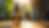 Eye-level view of a bottle of CBD oil on a wooden table