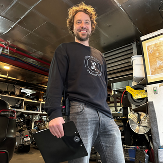 JP the owner of johnnypuetz posing for a picture at a video shoot