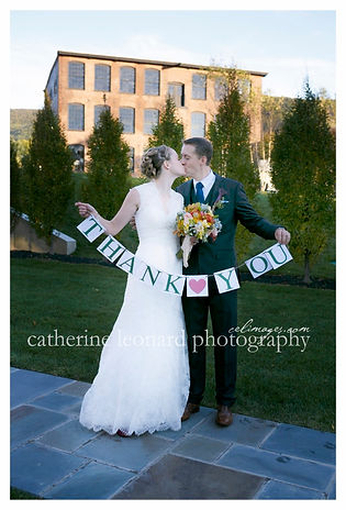 Bride and groom with boho chic bouquet and Thank you sign for guests by Mambo fiori best wedding florist Temecula CA