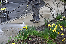 man-washing-off-dirt-men-uses-power-washer-spring-cleaning.jpg