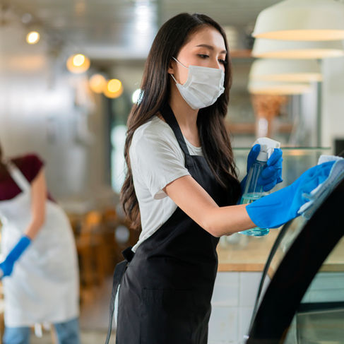 attractive-positive-young-asian-woman-staff-uniform-apron-spraying-detergent-alcohol-count