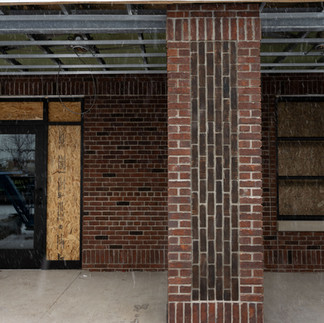 Brick entryway detail on exterior of Sparta Michigan mixed-use development