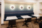 Bank break room with modern seating and cabinetry, highlighting quality construction and reliable subcontractor partnerships