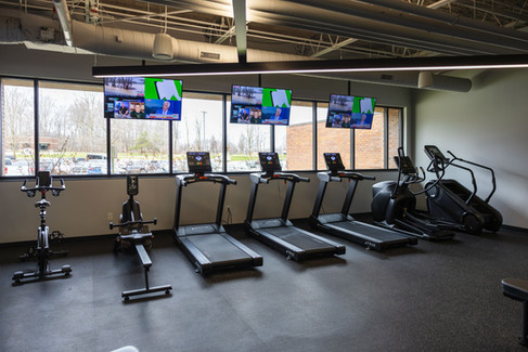 Fitness area with treadmills and cardio equipment in Applied Innovation office
