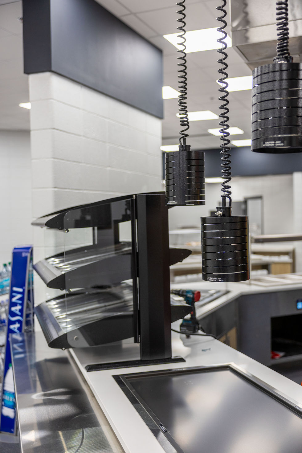 Modern kitchen equipment with sleek, metallic design.