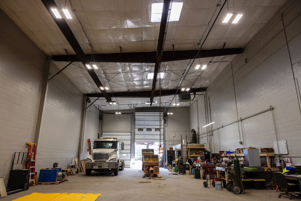Interior warehouse renovation featuring restored structure and upgraded commercial systems