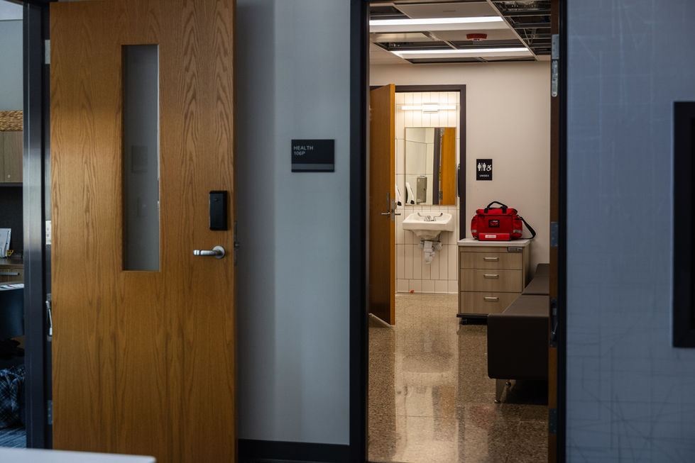 Open door revealing an office interior with desk.