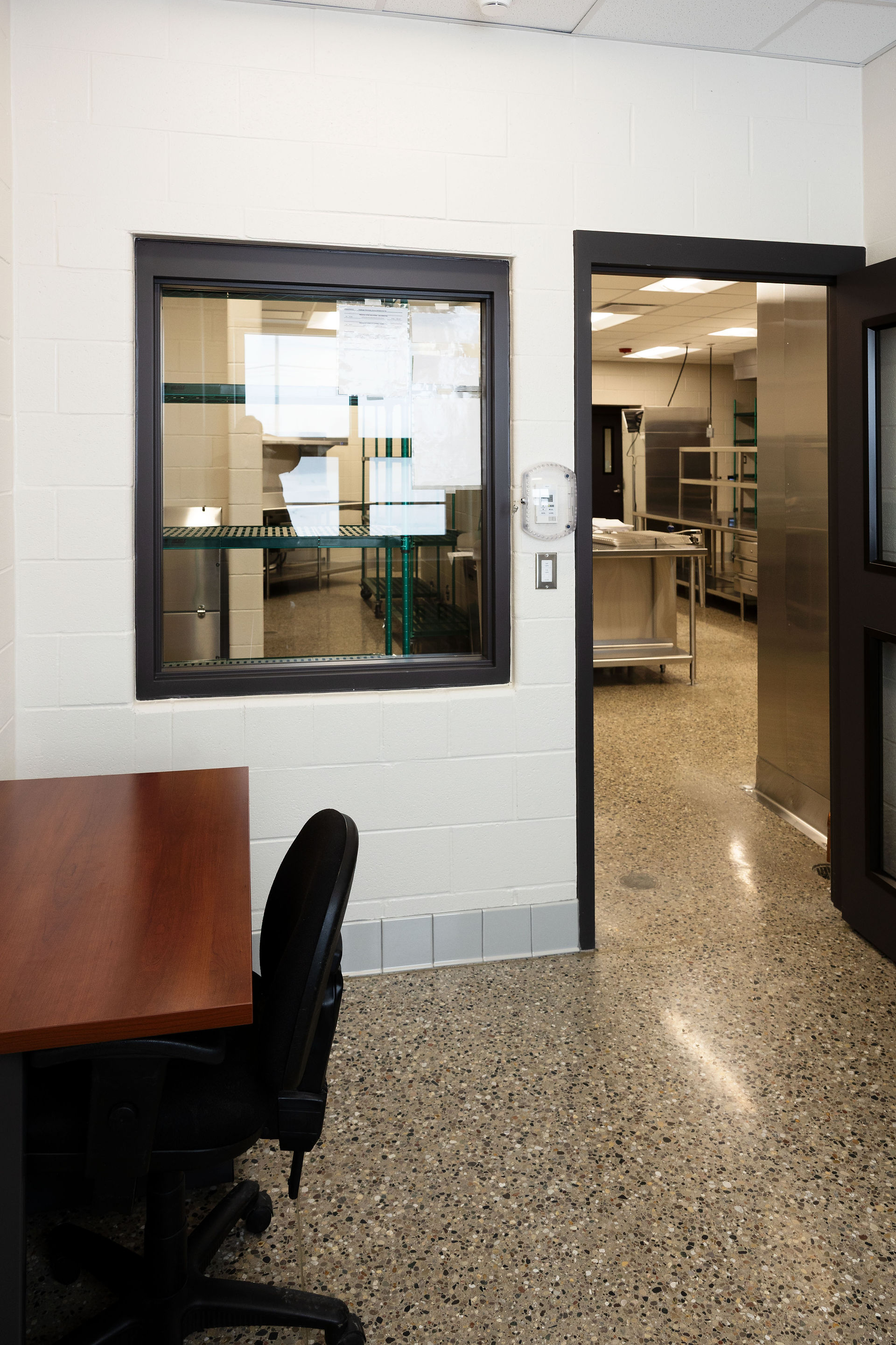Interior view of updated school kitchen and serving area at Challenger Elementary