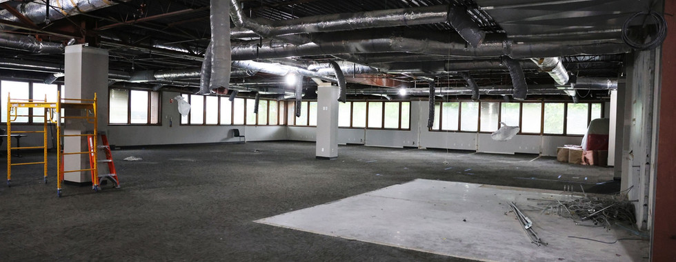 Open commercial space prepared for renovation after demo phase completion