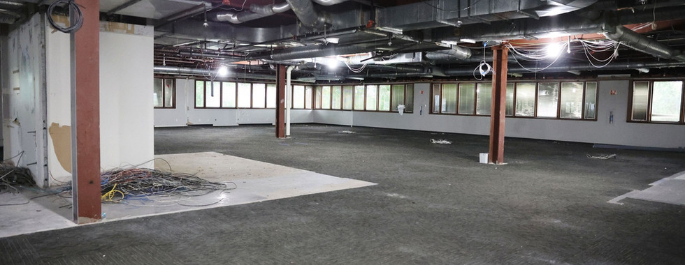 Wide view of commercial office space after demolition at Applied Innovation
