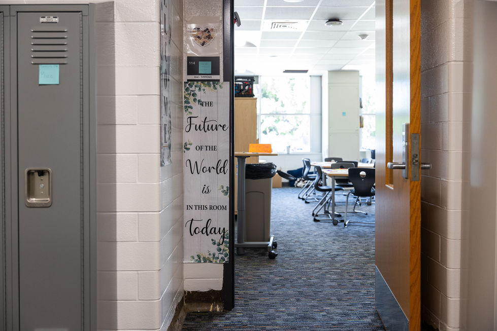 Classroom with motivational quotes on wall.