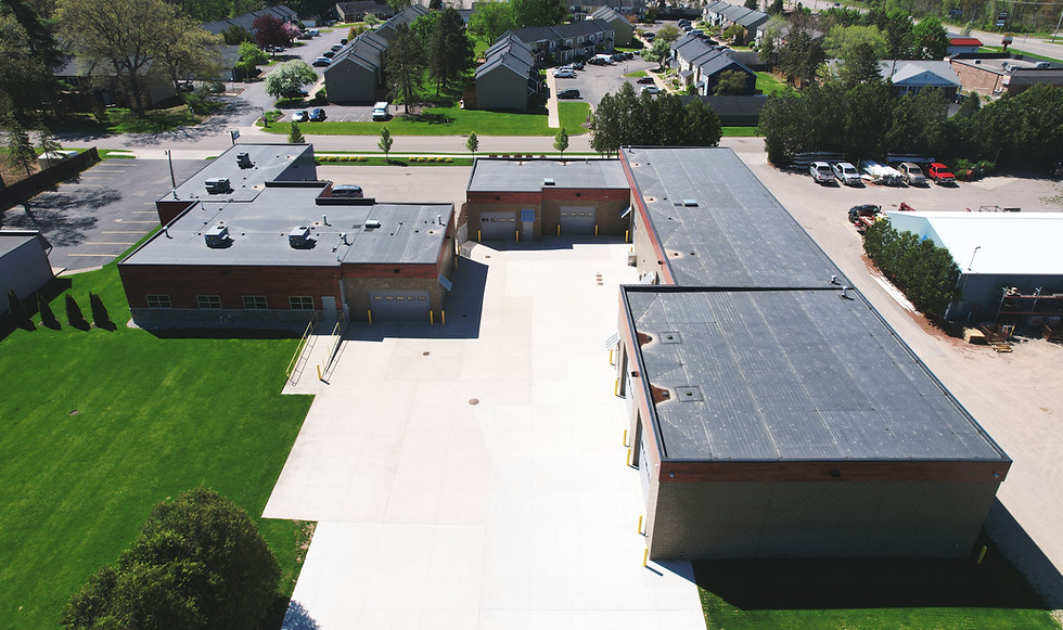 Aerial view of Fritz Wahlfield Construction headquarters built on the company’s original home site, showcasing office building and site layout