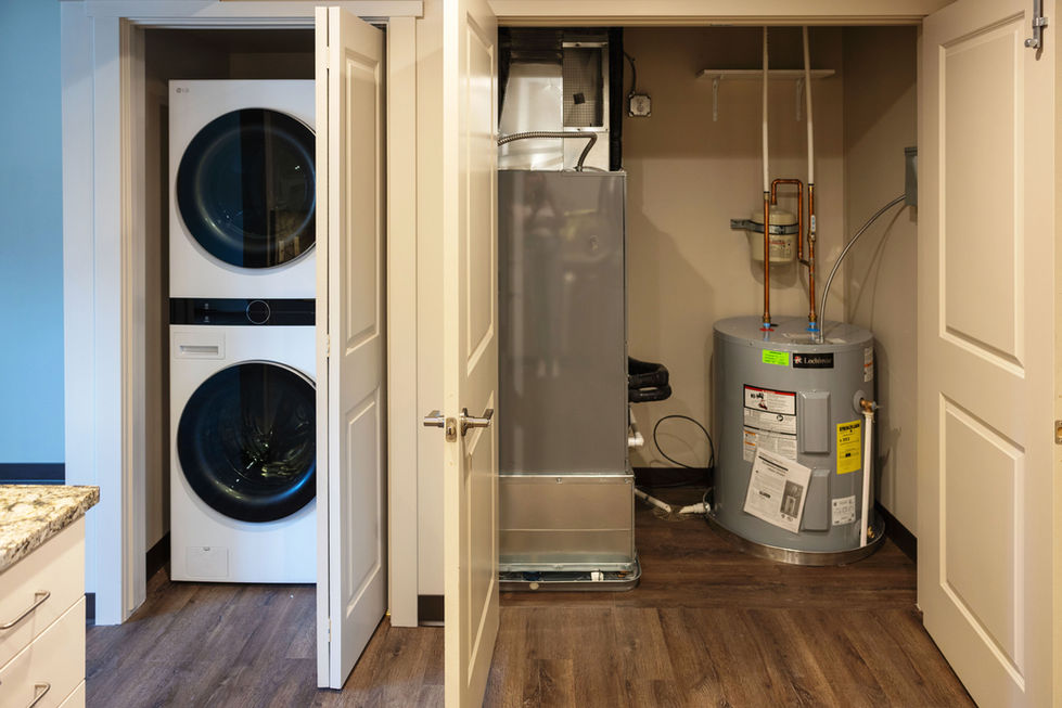 Laundry and utility room with washer, dryer, and heater.