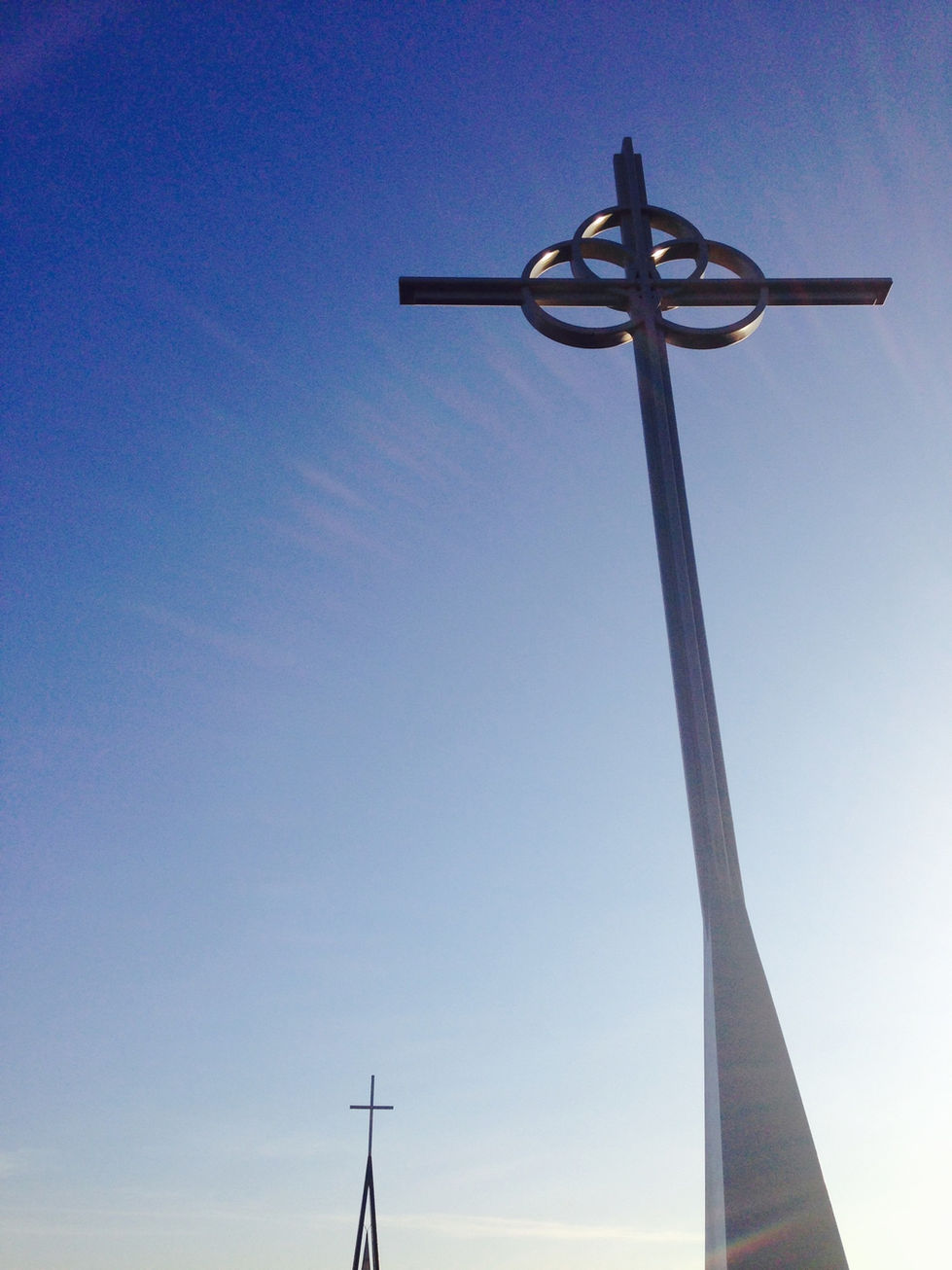 Cross against a clear blue sky.