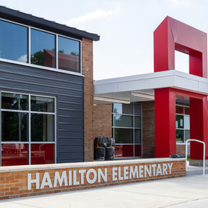 Modern school building with "Hamilton Elementary" sign.