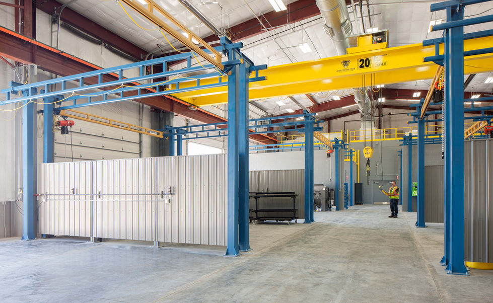 Industrial facility with machinery and large metal structures.