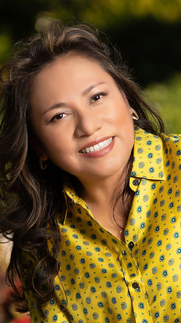 a photo of Ingrid Ventura Ellis, instructor, a woman with long brown hair, wearing a yellow shirt