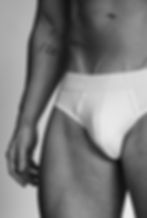 Thumbnail: Stanley poses wearing his "The Fates" white briefs, his tattoo on show