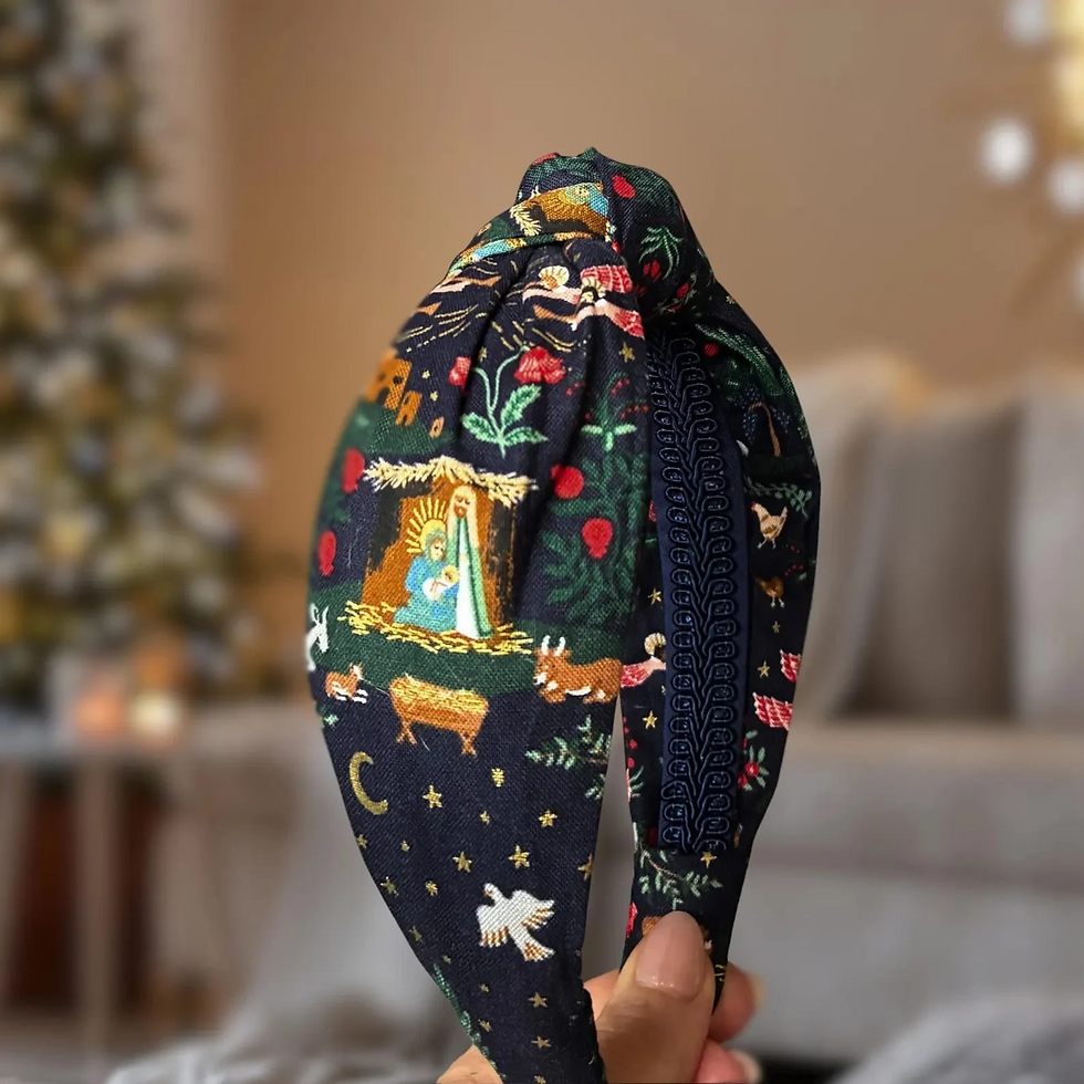 avy Nativity top knot headband by Bella Headbands with Holy Family imagery, red flowers, and gold stars.