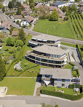 Schweiz Architektur Beton Massivbau Wohnbau rund