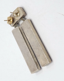 front of the earrings which show how much work was involved in creating them. High valued pair.