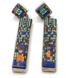 front of the earrings which show how much work was involved in creating them. High valued pair.