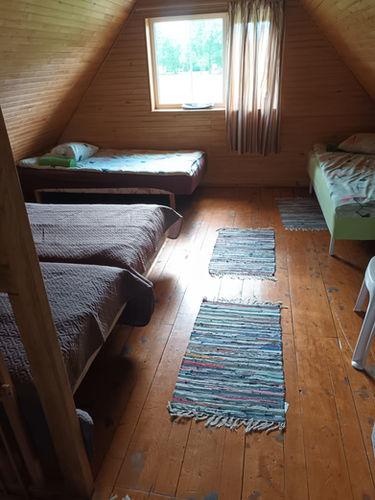 Pirts māja Madonas rajonā pie upes