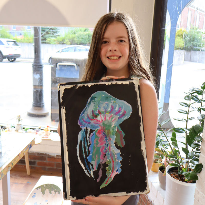 Student presenting artwork from a painting and drawing class at TONGWOOD Art Center