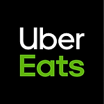 Uber Eats logo on black background for food delivery service.