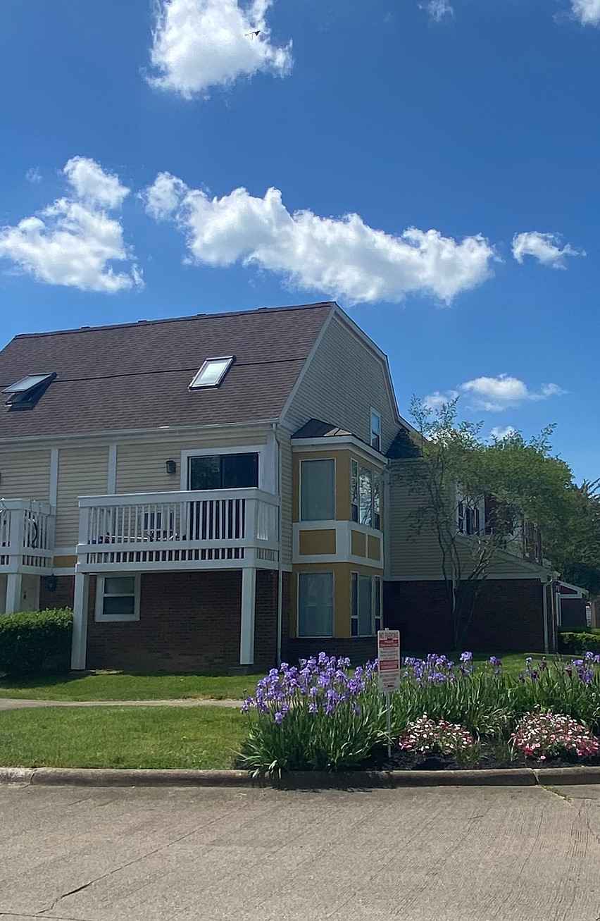 Exterior of Athens Station townhomes under blue sky.