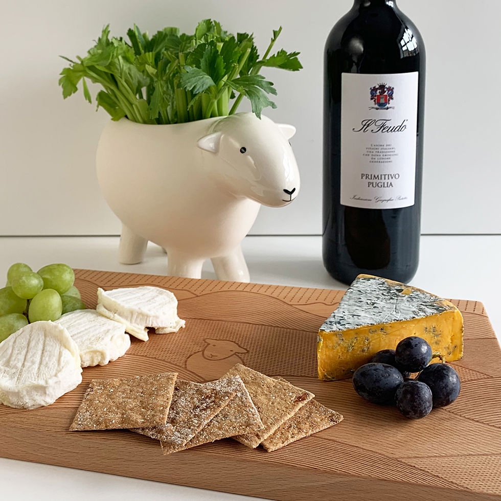 Herdy chopping board with cheese, crackers, grapes and wine