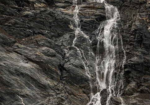 Peaceful relaxing water flowing over a rock 