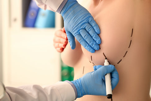 Examination of female breast by mammologist in blue protective gloves in hospital office b