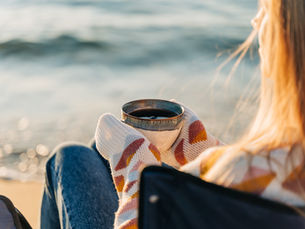 Savoring a cup of coffee next to Manzanita Beach