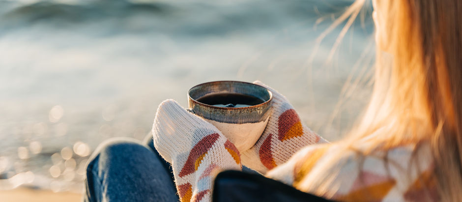 Savoring a cup of coffee next to Manzanita Beach