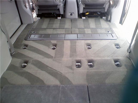 Eye-level view of a clean car floor mat after shampooing