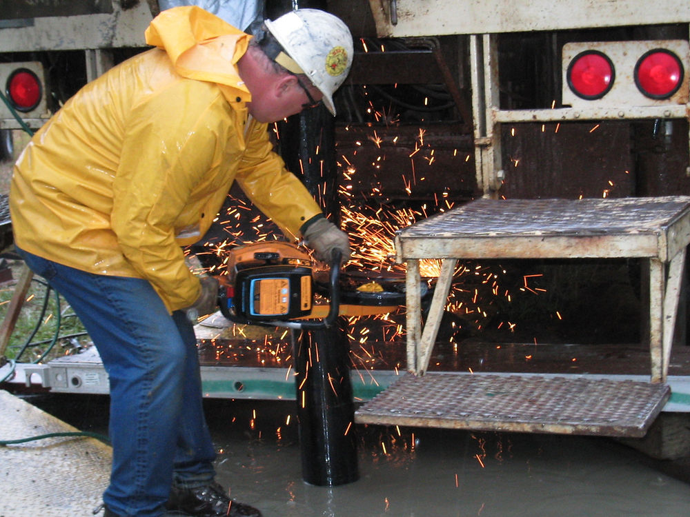 Welding the water well cap onto a flowing artesian water well