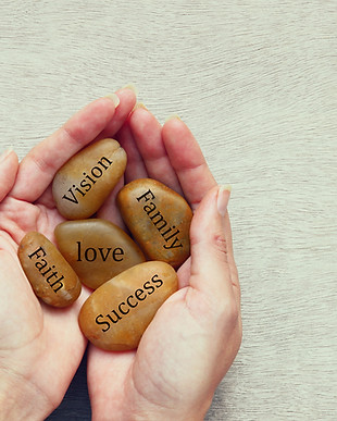 Hands Holding Inspirational Stones