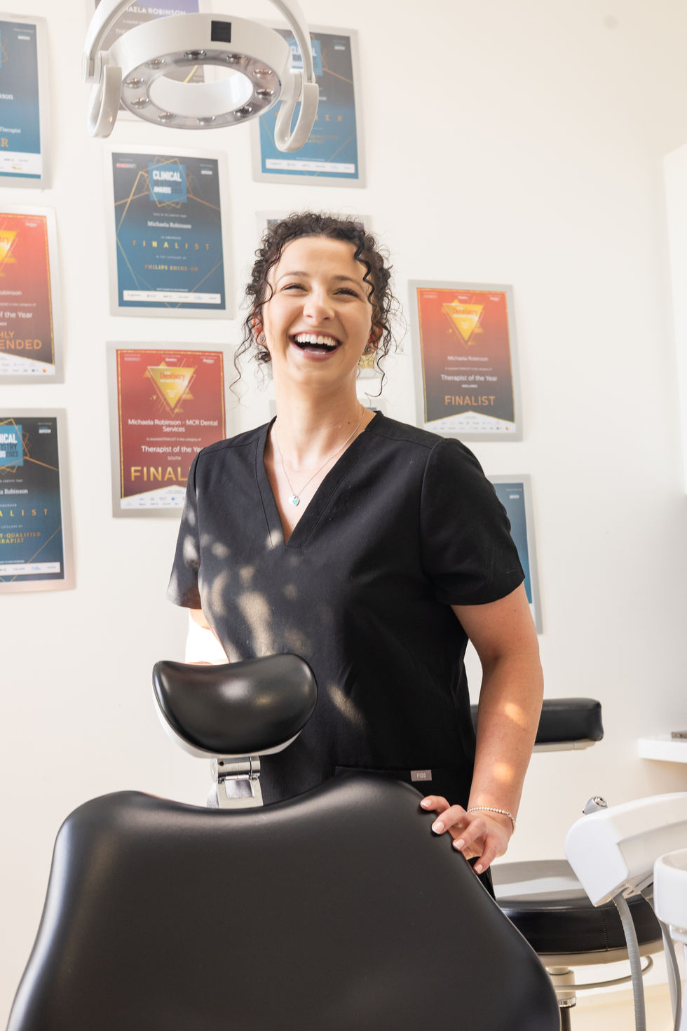 Female dentist smiling in their practise