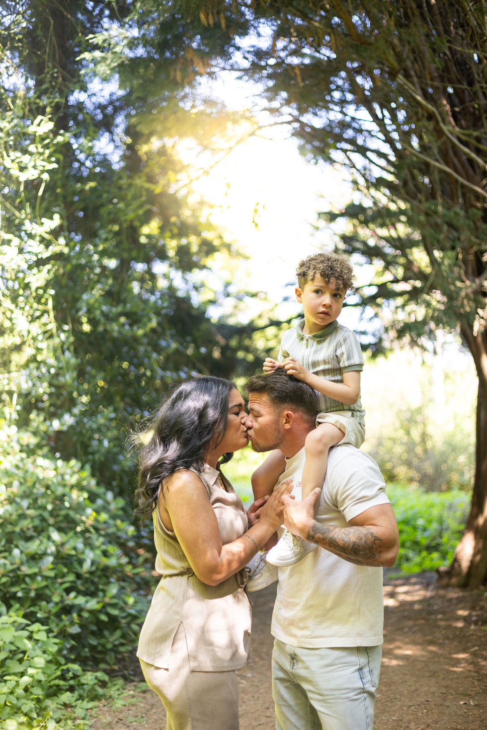 Family with mum, dad and young son in Autumn colours in Delapre Abbey Northampton