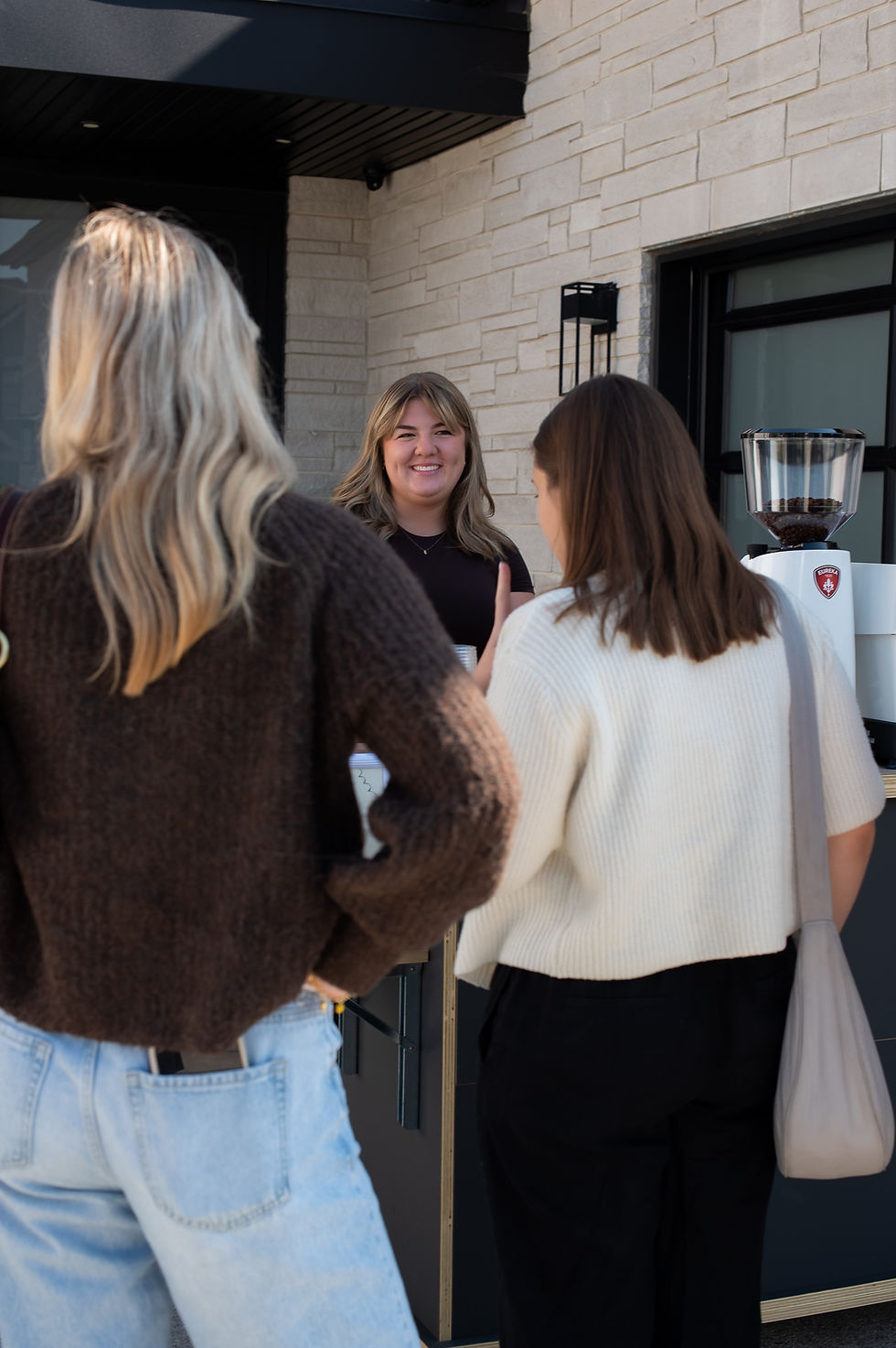 People in front of a coffee cart