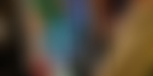 A bride's reflection is in the mirror photo booth which is displaying an animation that read show me some love